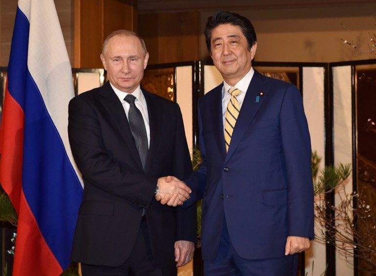 Putin, Abe hold hot spring meet on WWII island row