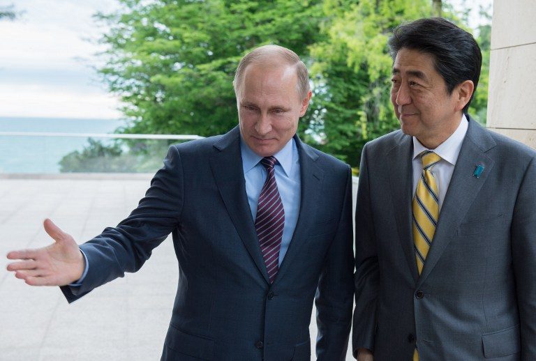 Putin heads to Japan for hot spring meet on disputed islands