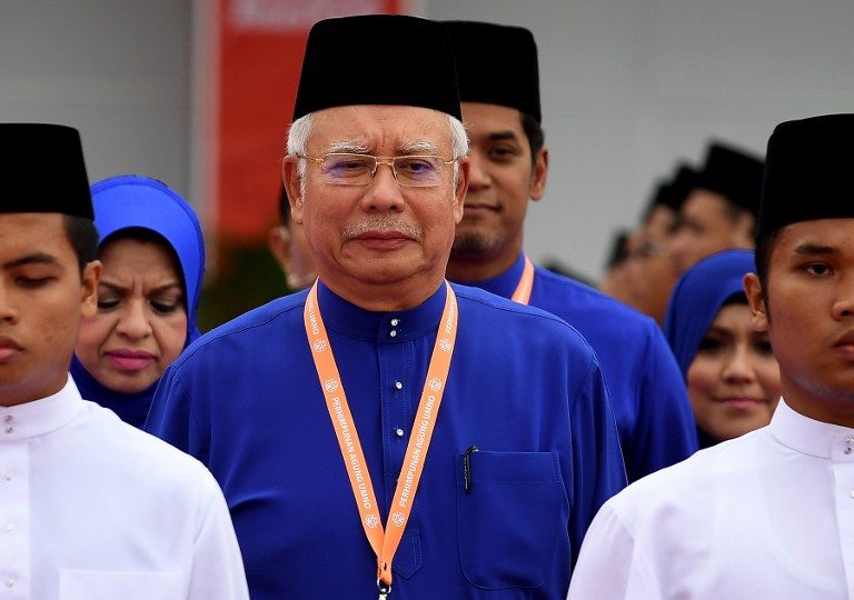 Malaysian PM eyes snap poll, vows fight to the death