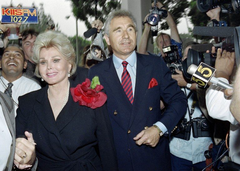 This file photo taken on September 11, 1989 shows US actress Zsa Zsa Gabor and d by her husband Prince Frederick von Anhalt, Germany's duke of Saxony, entering Beverly Hills Municipal Court on September 11, 1989.  Wade Byars/AFP/File 