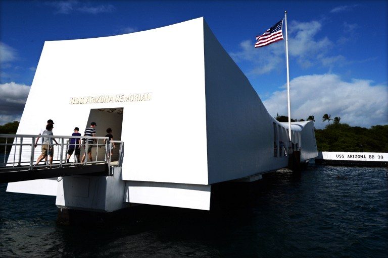The USS Arizona Memorial, marking the resting place of the crewmen killed on December 7, 1941 when Japanese Naval Forces bombed Pearl Harbor, is pictured on December 24, 2016 in Pearl Harbor, Hawaii. Jerome Cartillier/AFP 