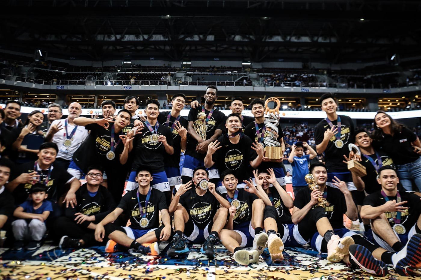 PERFECTION. The Ateneo Blue Eagles flash their trophies and three-peat championship shirts. Photo by Josh Albelda/Rappler   