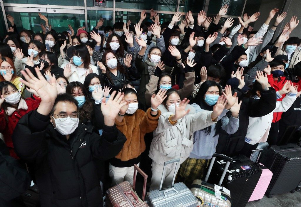 Chinese students fleeing virus face uneasy reception back home