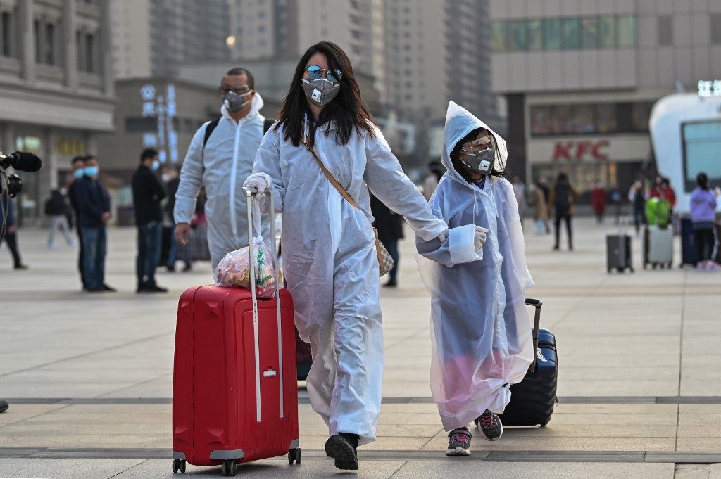 Exodus begins as virus-hit Wuhan lifts ban on outbound travel
