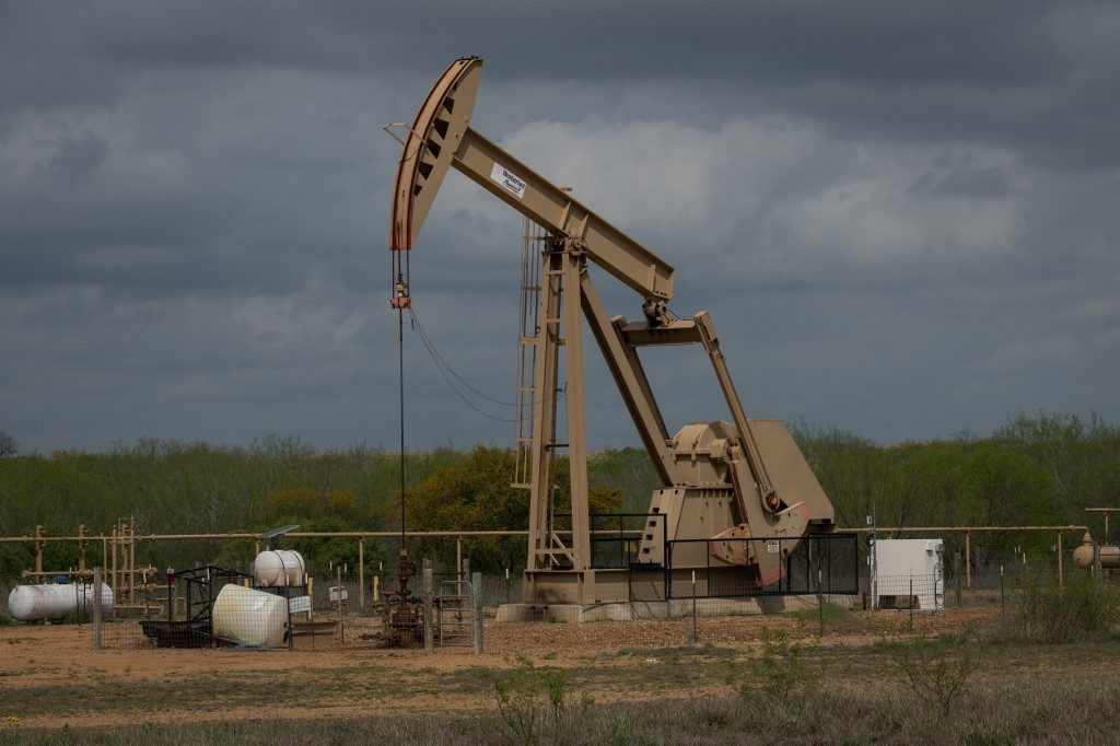 Devastating oil glut sends prices into negative, Wall Street down
