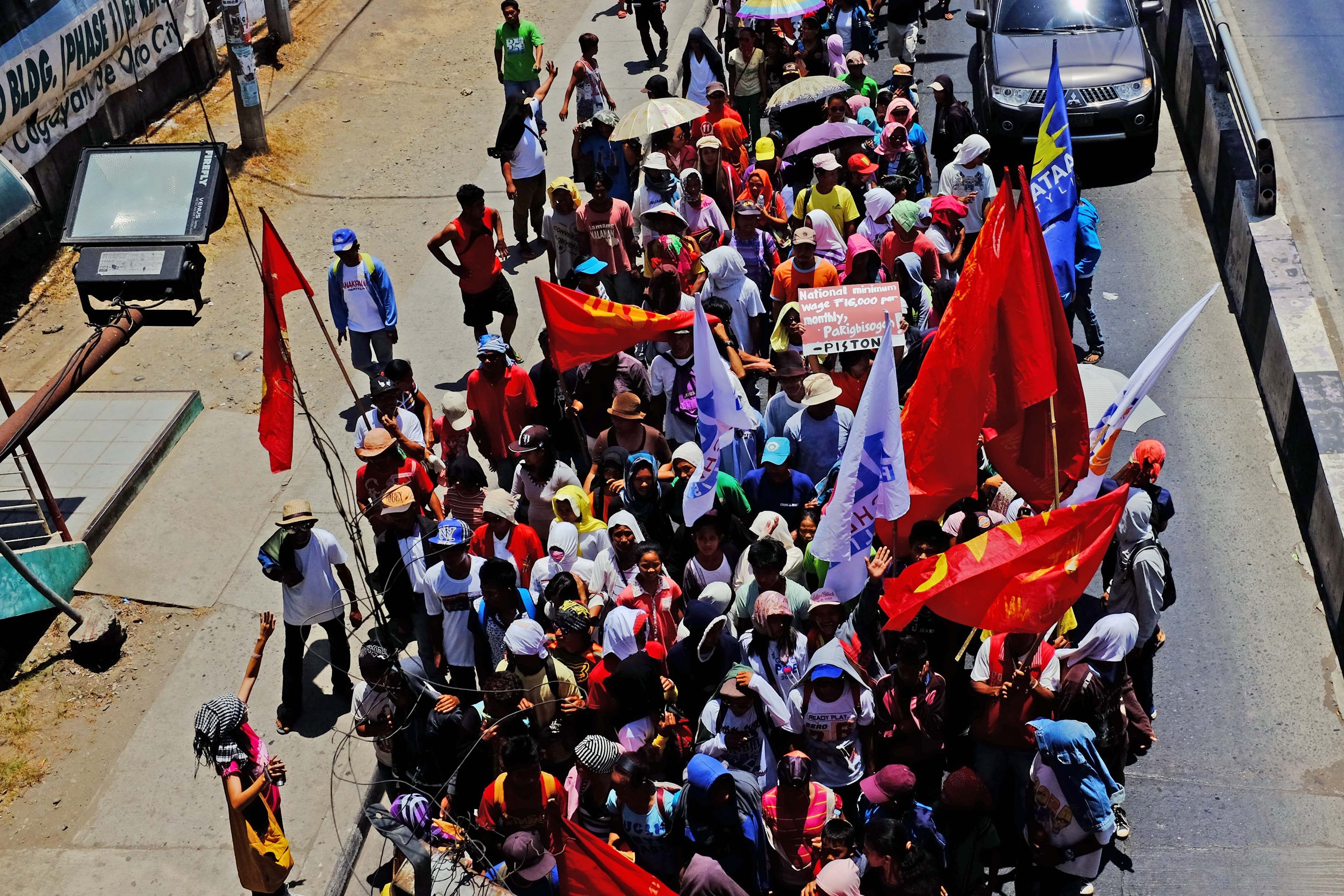 LABOR DAY PROTEST. Workers from Misamis Oriental march through the streets on May 1, 2016. Photo by Bobby Lagsa/Rappler 