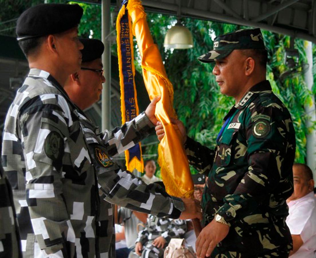 CHANGE OF COMMAND. Armed Forces of the Philippines Chief of Staff Lt. General Ricardo Visaya leads the turnover of command of the Presidential Security Group at the PSG Grandstand in Malacanang Park on July 2, 2016. Incoming PSG chief Lt. General Rolando Joselito D. Bautista (PA) receives the command flag from outgoing commander Rear Admiral Raul Ubando (PN). Photo by Marcelino Pascua/Malacañang PPD   
