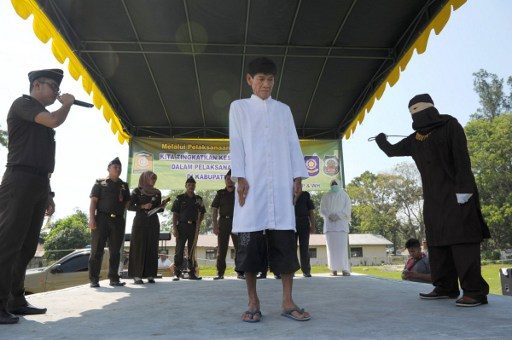 Non-Muslims caned in Indonesia under sharia law