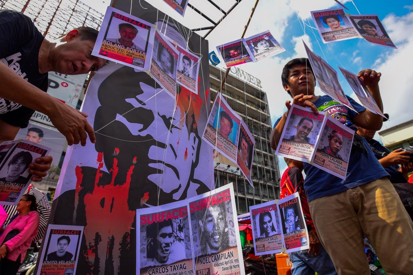 ALL SOULS DAY. Families of desaparecidos hang pictures of their missing relatives as they call for justice for their loved ones and other victims of human rights violations on All Souls' Day, November 2, 2018 in Manila. Photo by Maria Tan/Rappler  