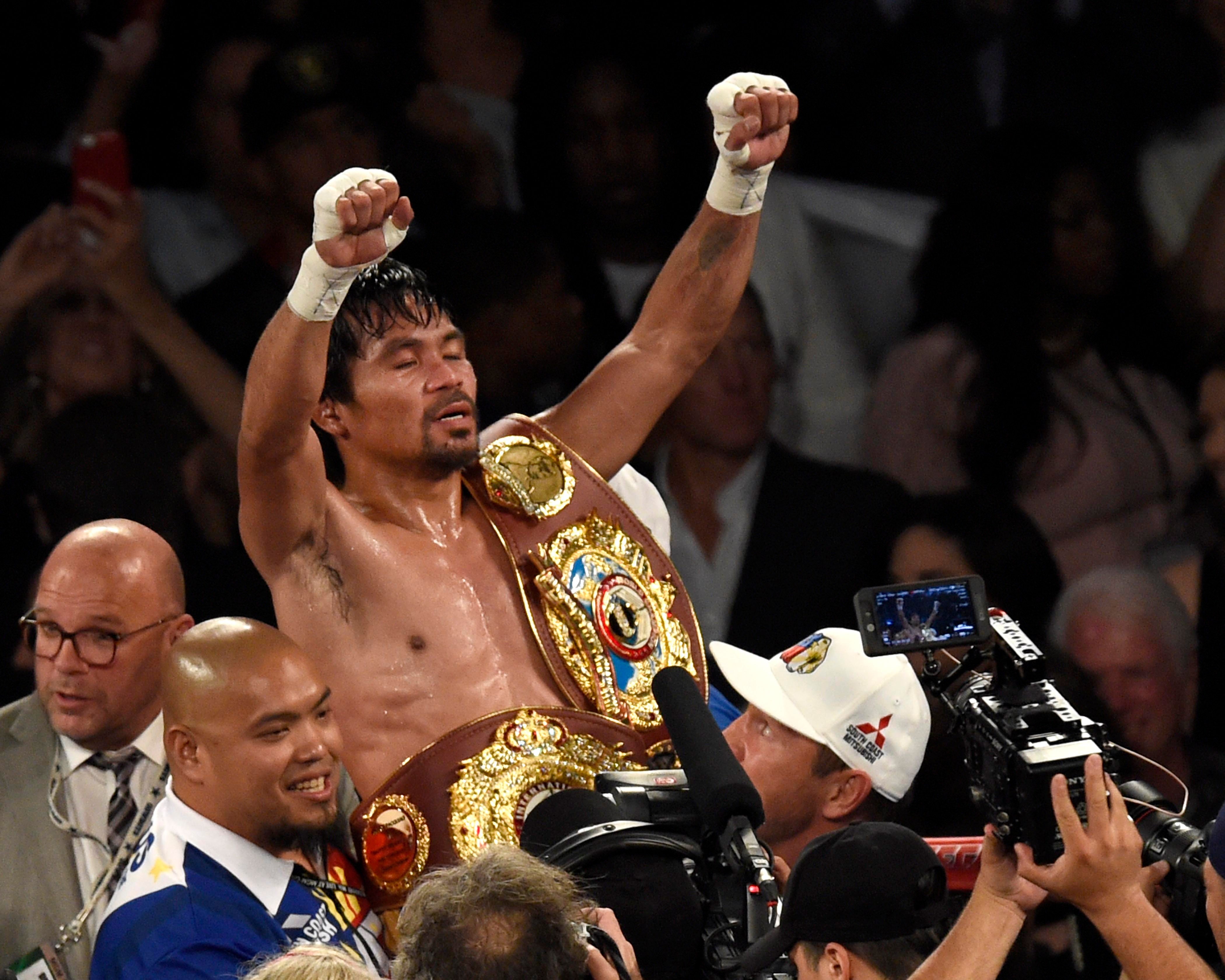 VICTORIOUS. Manny Pacquiao is poised to become one of the 12 senatorial winners. File photo by EPA/JOHN G. MABANGLO 