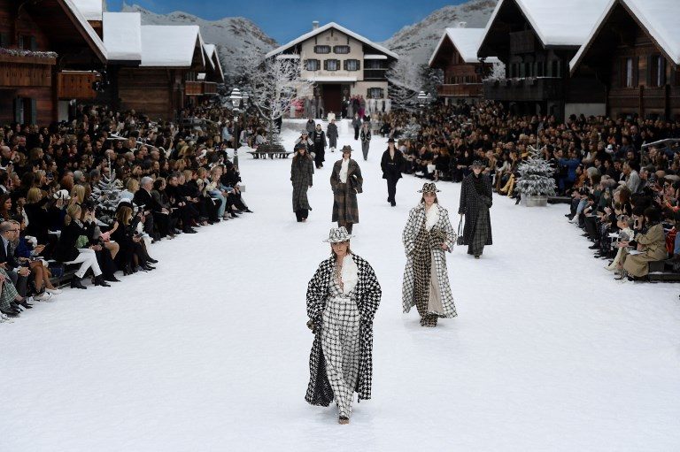 CATWALK. British model Cara Delevingne (C) presents a creation by Chanel during the Women's Fall-Winter 2019/2020 Ready-to-Wear collection fashion show at the Grand Palais turned into a wintry village in Paris on March 5, 2019. Photo by Christophe Archambault/AFP   