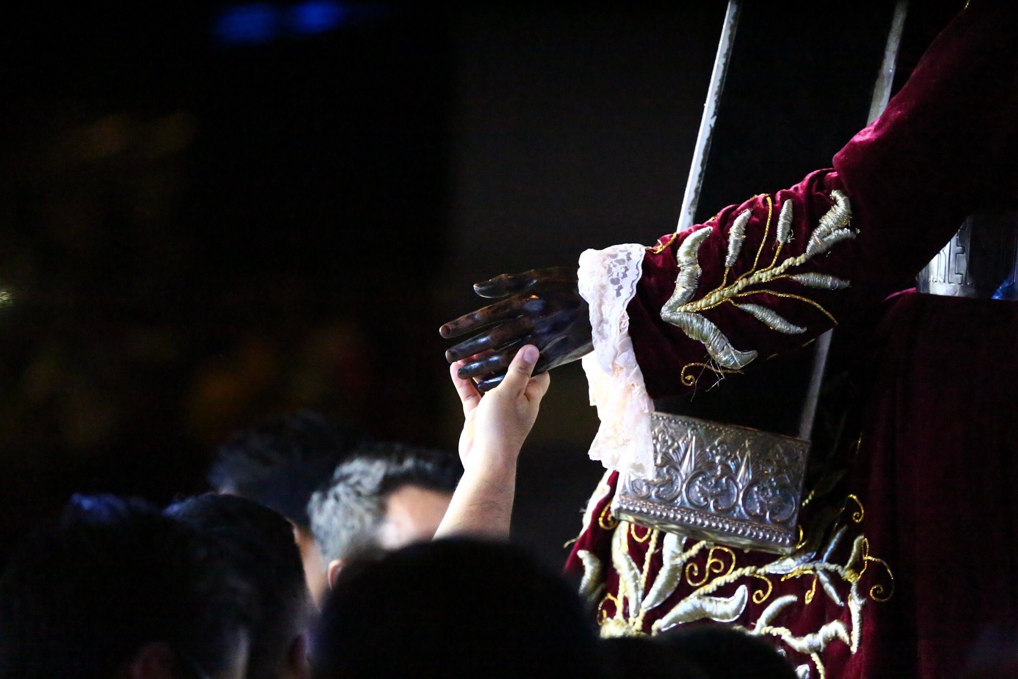 I BELIEVE. A devotee reaches out to the hand of the image of the Black Nazarene. Photo by Jire Carreon  