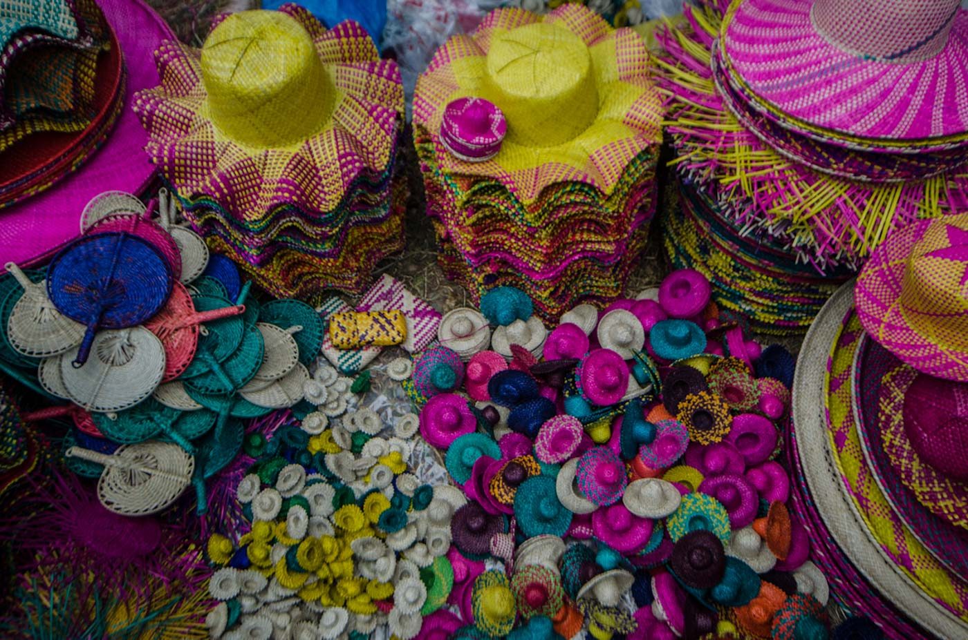 COLORFUL SOUVENIRS. Hats and abanico fans can be bought by tourists for pasalubong 
