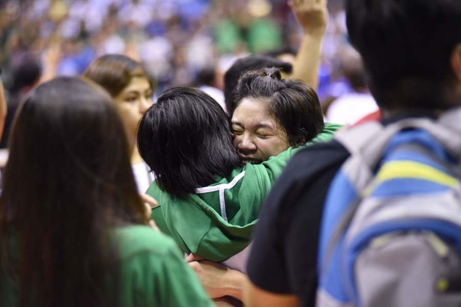 TEARS. Graduating Mika Reyes also breaks down in tears after winning the title in her final UAAP game. Photo by Martin San Diego/Rappler 