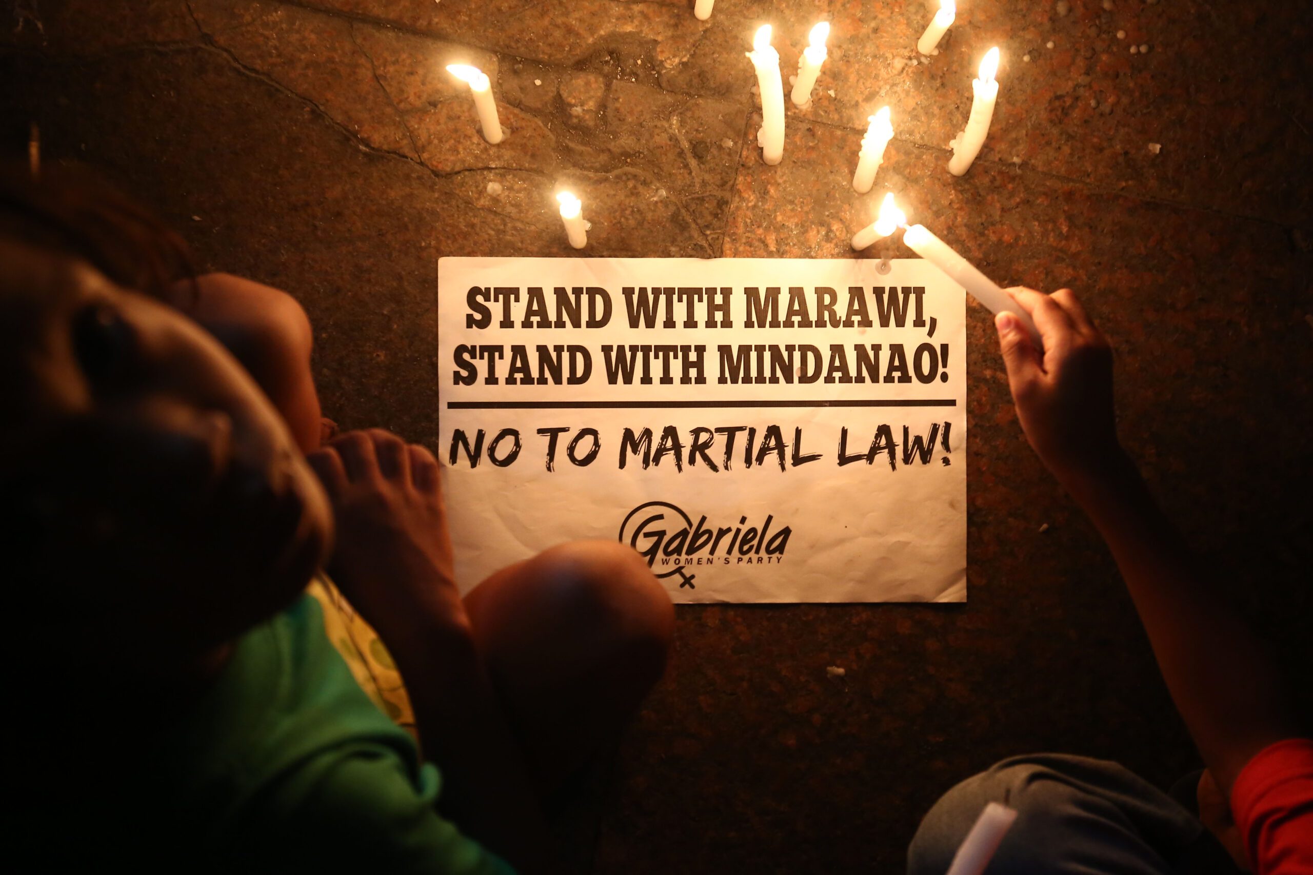 IN PHOTOS: Advocates light candles rejecting martial law