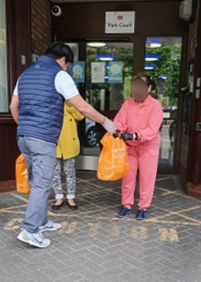HELP FROM A FRIEND. Filipinos deliver grocery items to fellow Filipinos in the UK. Photo courtesy of Kanlungan Filipino Consortium.  