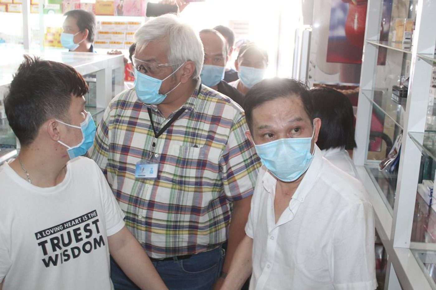 BUST. Mayor Carmelo Lazatin Jr. (center) inspects the suspected illegal Chinese pharmacy. In the foreground are the alleged Chinese owner and pharmacist of the drug store. (Photo from Facebook page of Angeles City information office) 