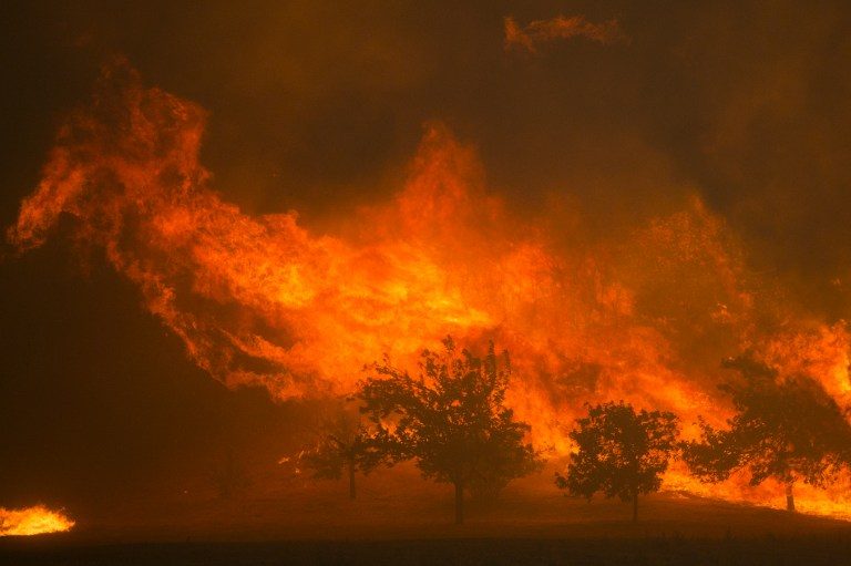 Massive fires rage in California