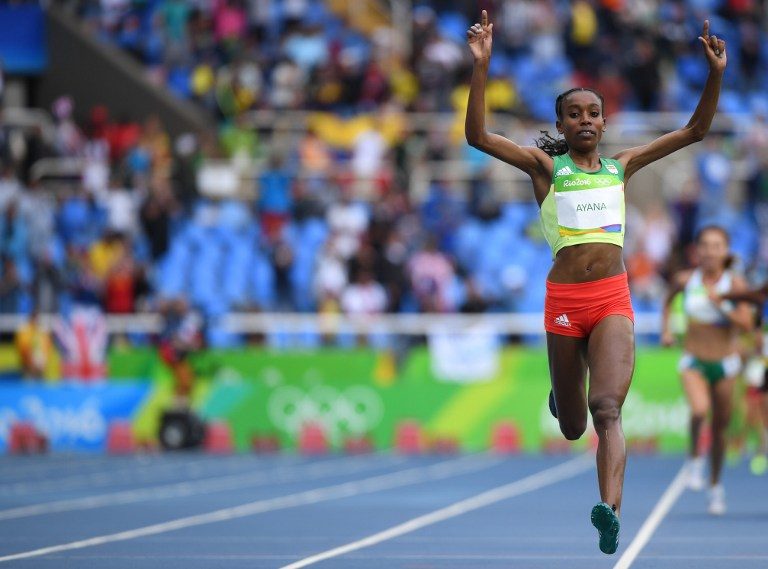 RECORD HOLDER. Ethiopia's Almaz Ayana celebrates after she broke the world record in the Women's 10,000m during the athletics event at the Rio 2016 Olympic Games at the Olympic Stadium in Rio de Janeiro on August 12, 2016. Olivier Morin/AFP 