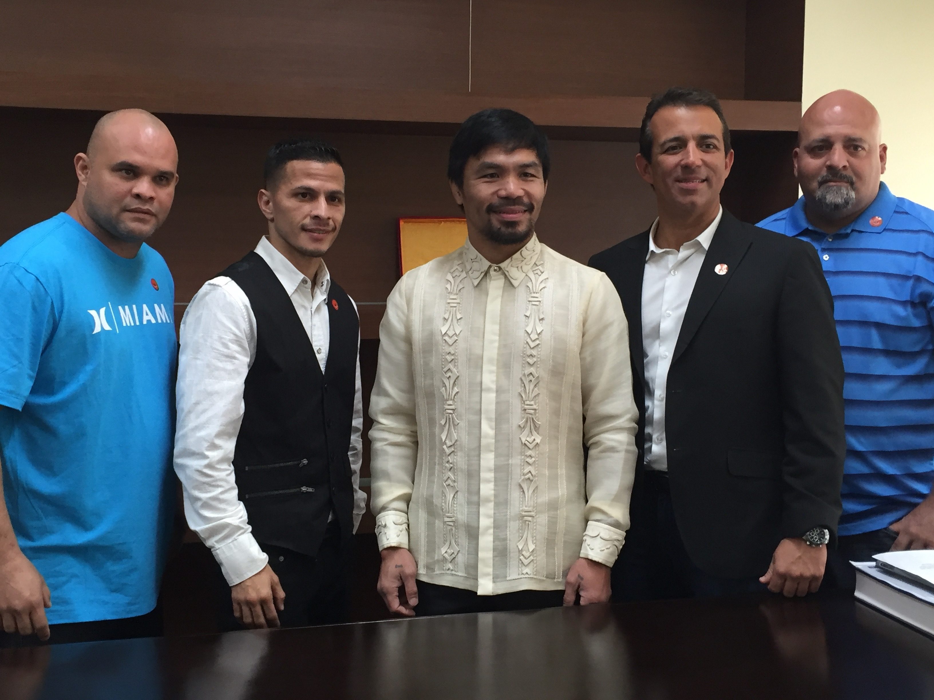 Manny Pacquiao poses with the camp of McJoe Arroyo. Photo by Ryan Songalia 