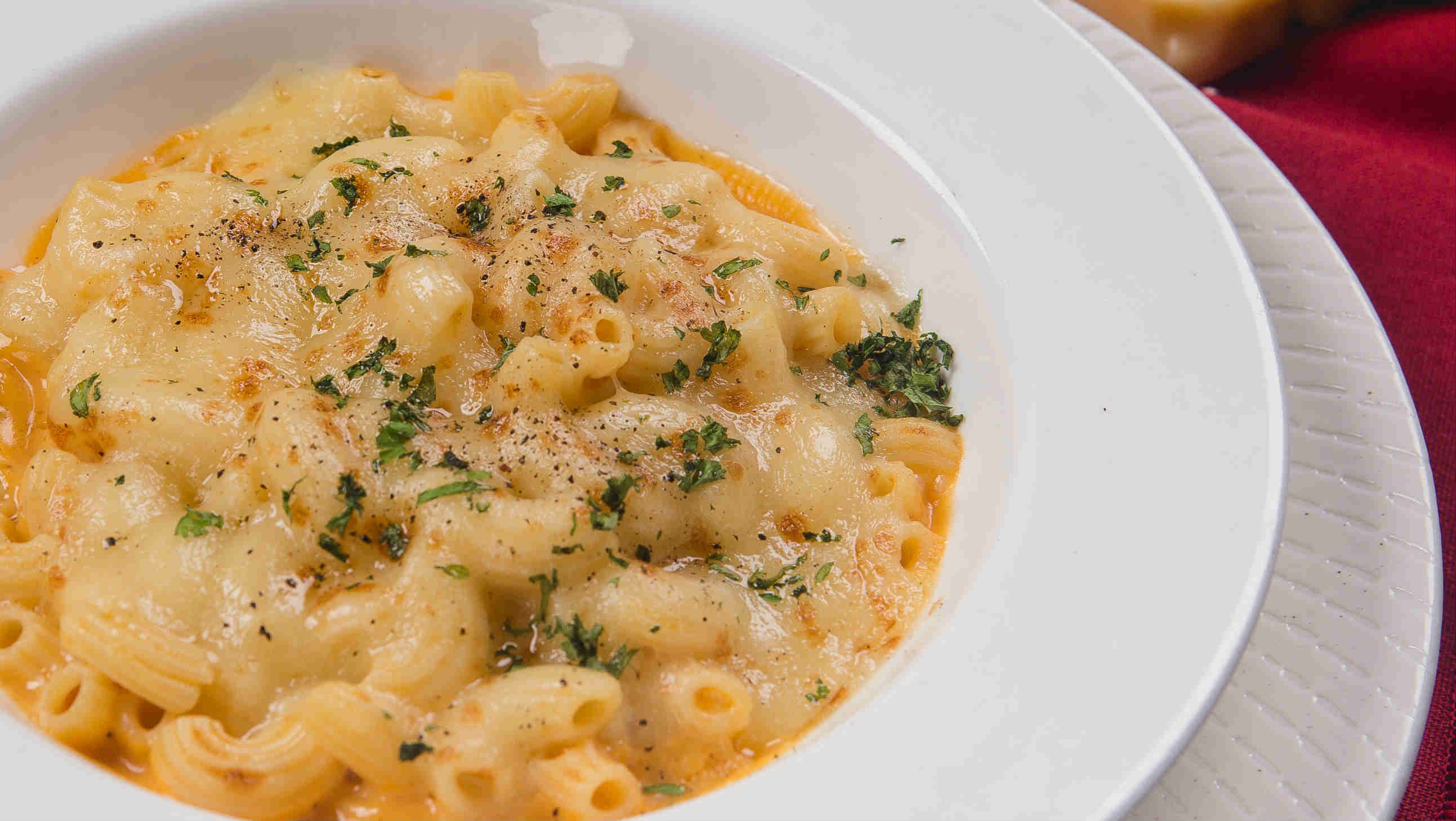 TRUFFLE MAC 'N CHEESE. Macaroni cooked in a 3-cheese sauce and infused with white truffle oil. Take a bite for P280
  
