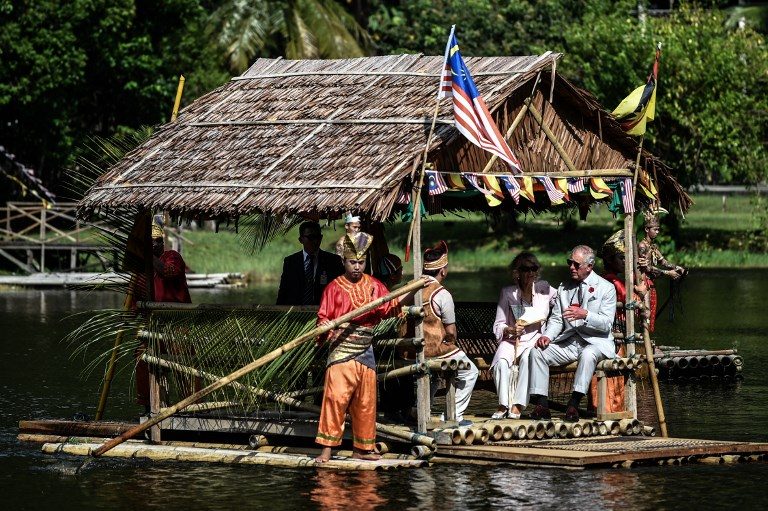 ROYAL COUPLE. Britain's Prince Charles, Prince of Wales and Camilla, Duchess of Cornwall ride on a raft at the Sarawak Cultural Village in Santubong, outside Kuching, on the island of Borneo, on November 6, 2017. Photo by Mohd Rasfan/AFP 
