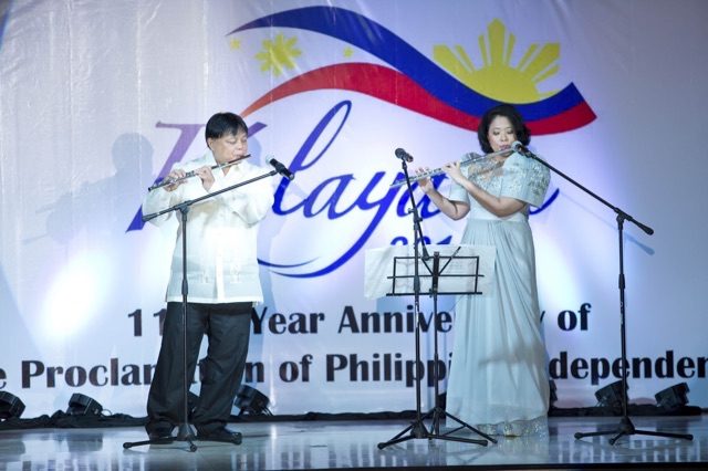 Minister Councilor Ma Antonina Oblena plays the flute during the Philippine Independence Day reception. Photo courtesy Philippine Embassy in Kuala Lumpur, Malaysia  