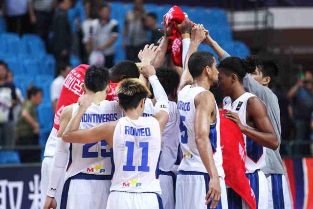 VICTORIOUS. Gilas Pilipinas huddles up at centercourt after the glorious victory over giants Iran. Photo from FIBA  