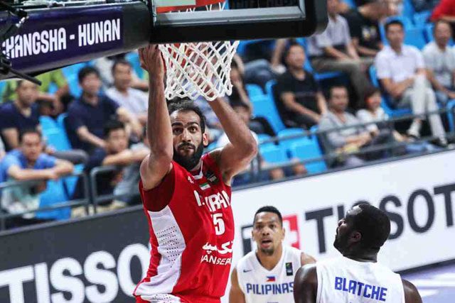 BIG MAN OUT. Iran's 7-foot-2 big man Hamed Haddadi is limited to just 10 points and 7 rebounds as he fouled out with under 4 minutes remaining in the game. Photo from FIBA 