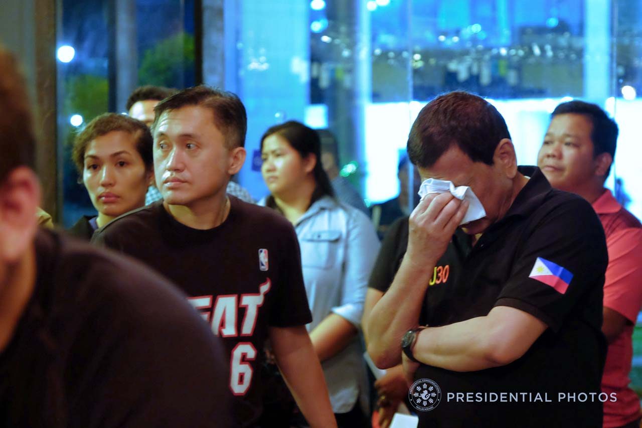 IN SYMPATHY. President Rodrigo Duterte cries upon hearing the news that the victims trapped inside NCCC Mall in Davao City have zero chances of survival. Malacañang photos 