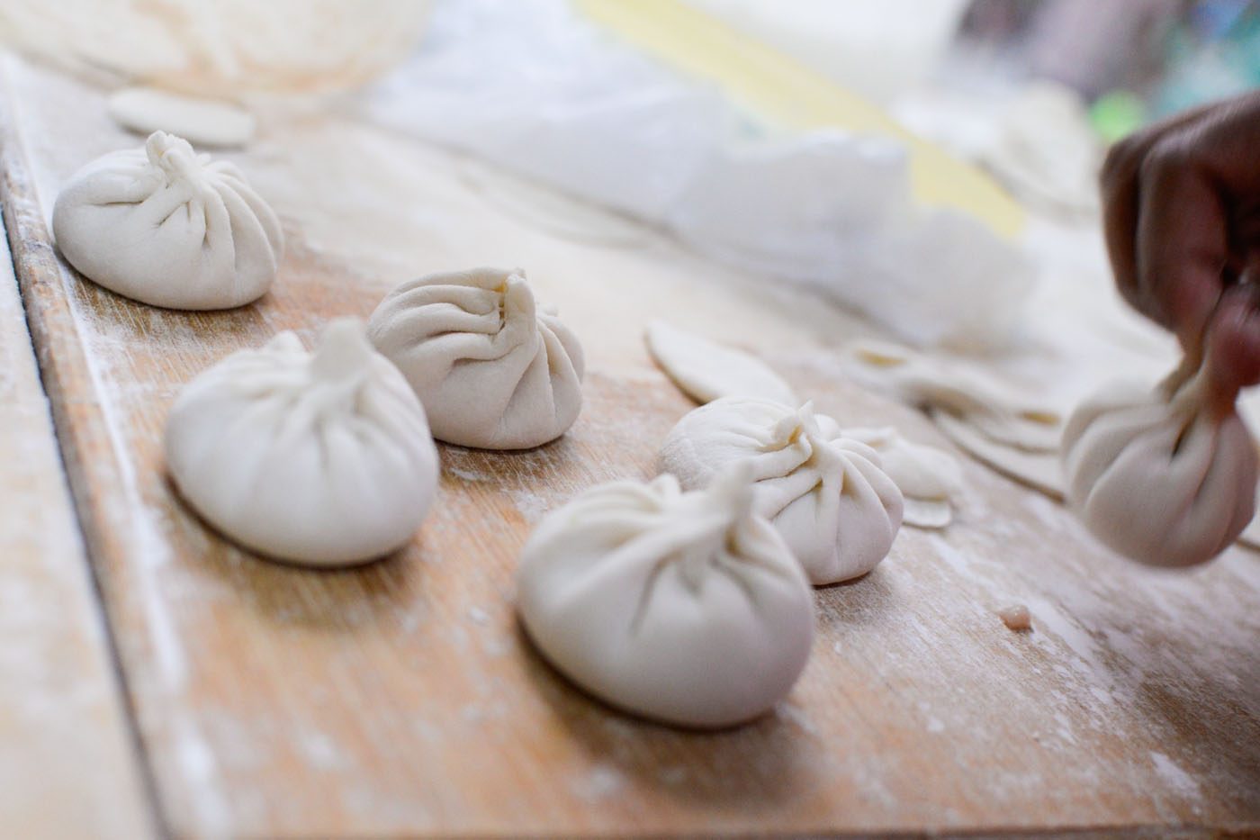 IN PROGRESS. Xiao long bao being made at Dong Bei Dumplings. Photo by Alecs Ongcal/Rappler 