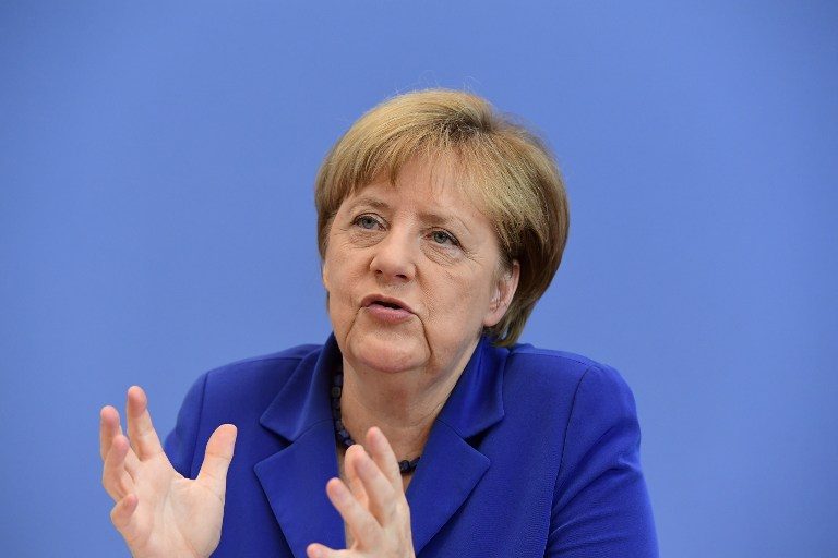 Defiant Merkel defends refugee stance after attacks