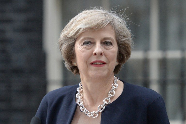 New British PM May rounds out Brexit cabinet