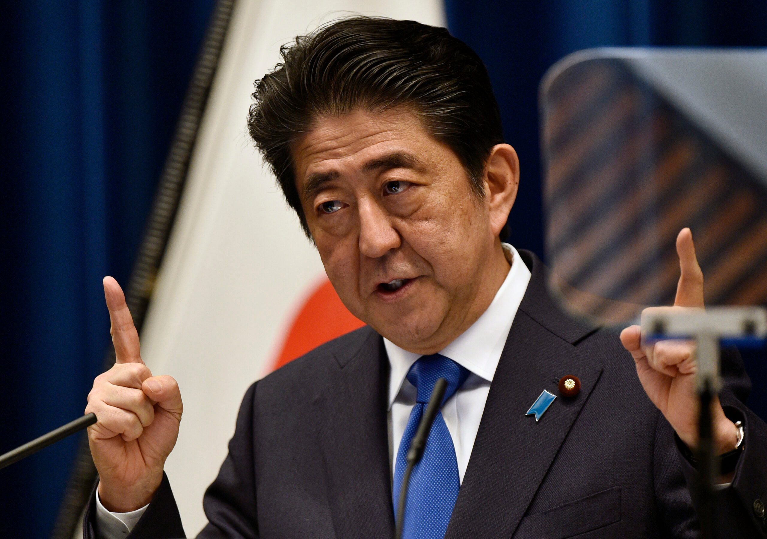Japan PM delays tax hike in blow for Abenomics