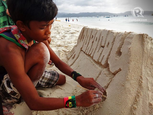 SAND ART. A local kid intently sculpting Boracay’s fine sand. Photo by Rhea Claire Madarang 