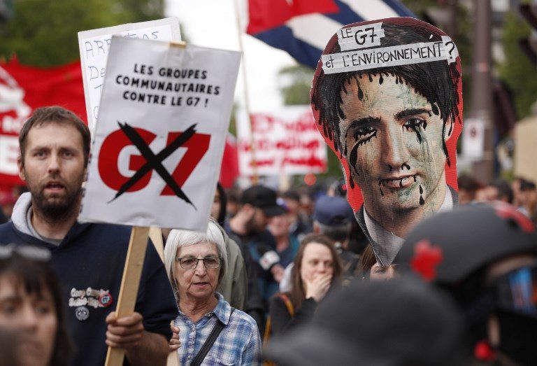 SUMMIT PROTEST. Anti-G7 protesters gather for a demonstration in Quebec City, on June 7, 2018, the eve of the leaders' summit. Photo by Lars Hagberg/AFP   