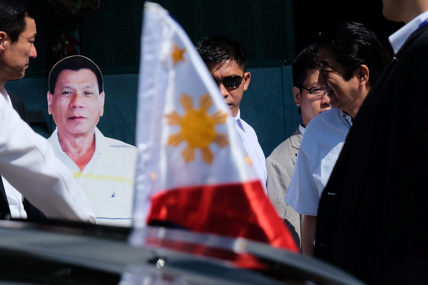 CARDBOARD SENTINEL. Japan Prime Minister Shinzo Abe chuckles upon seeing the standee of President Rodrigo Roa Duterte outside his residence. Photo by Rene Lumawag/PPD 