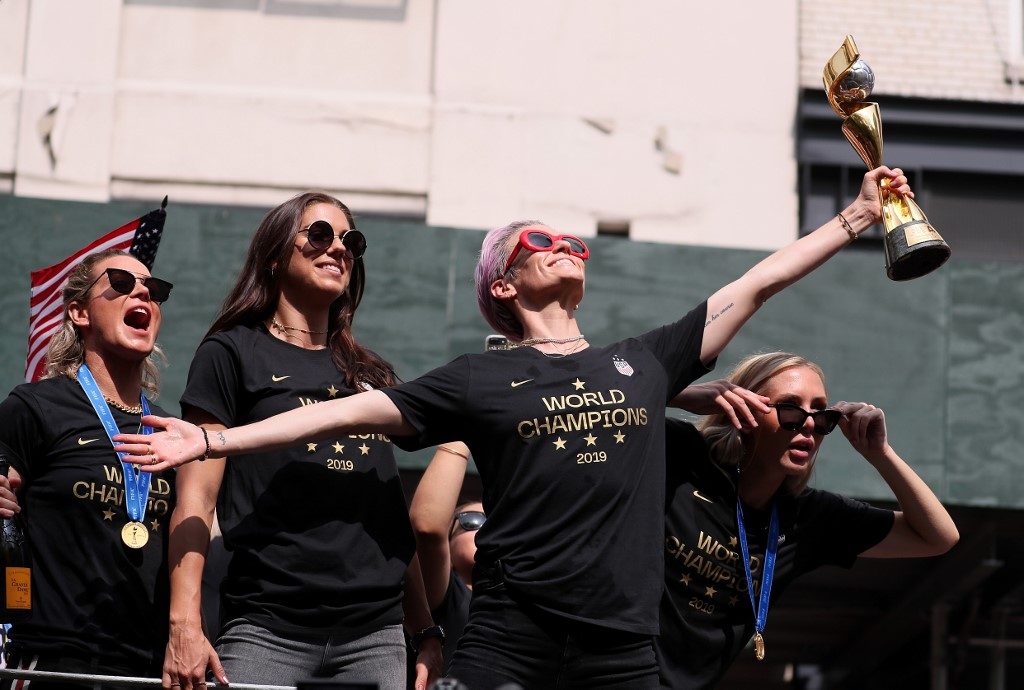U.S. World Cup champ feted with confetti, chants of ‘equal pay’