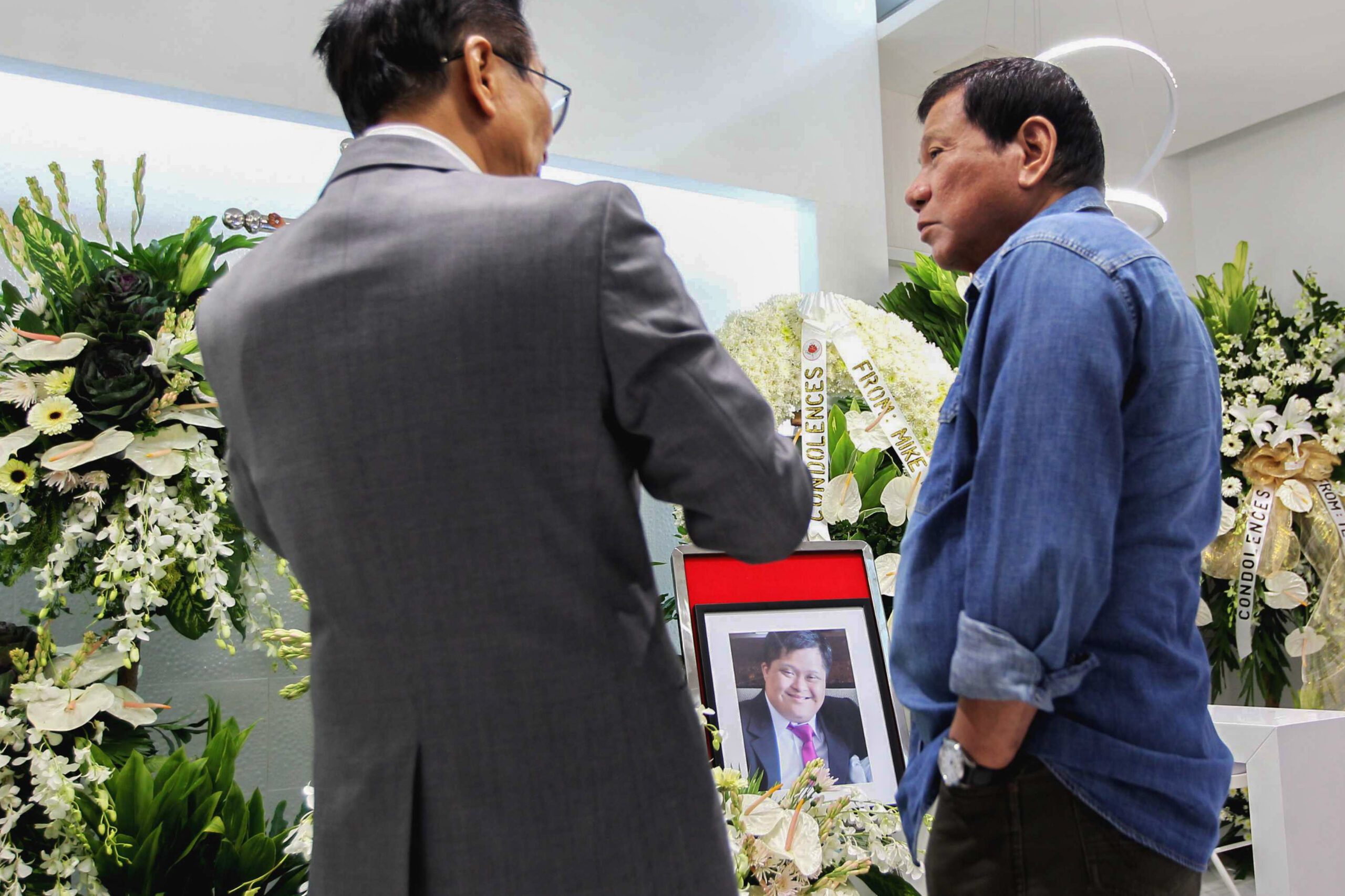 IN PHOTOS: Duterte visits wake of Panelo’s son, cop killed in anti-drug war