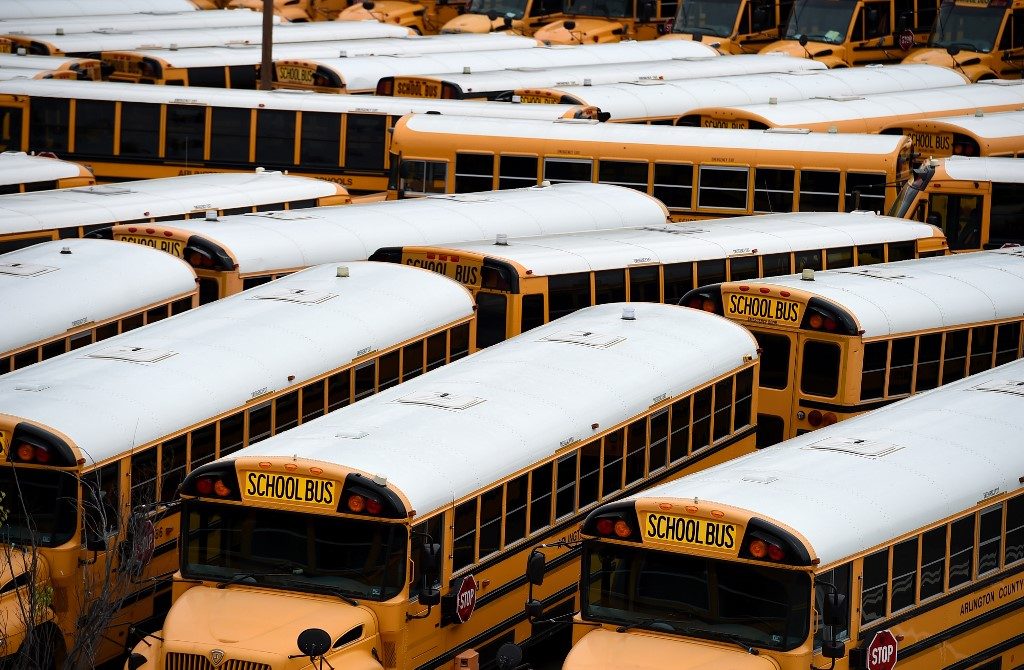 BUSES. In this file photo taken on March 31, 2020 about 100 school buses are parked at the Arlington County Bus Depot, in response to the COVID-19 outbreak in Arlington, Virginia. Photo by Olivier Douliery/AFP 