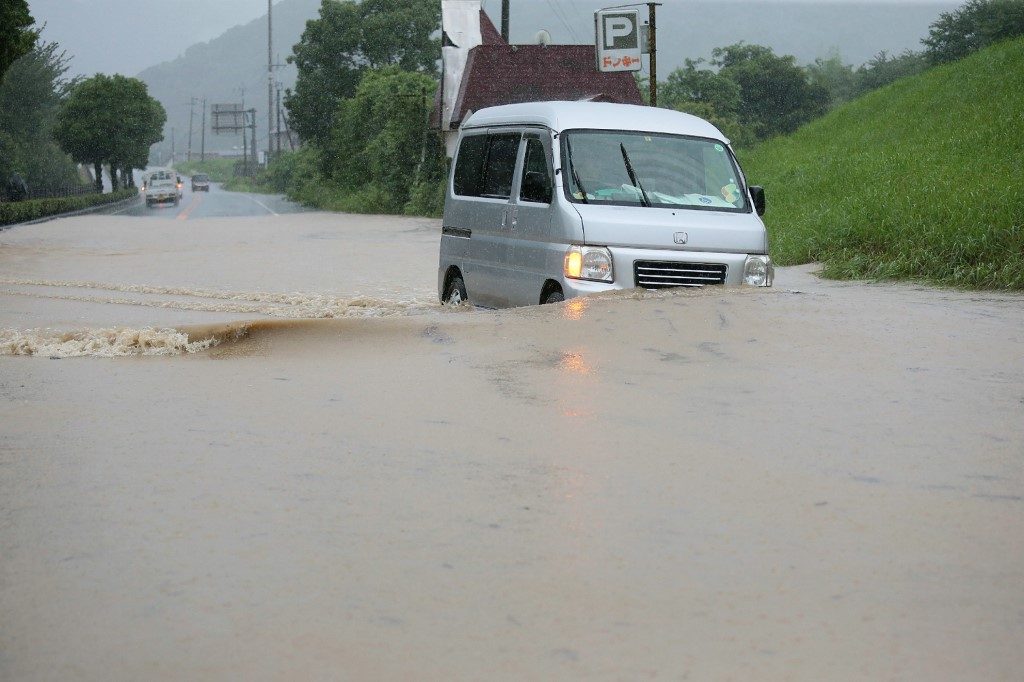 2 feared dead, 13 missing as heavy rain lashes western Japan