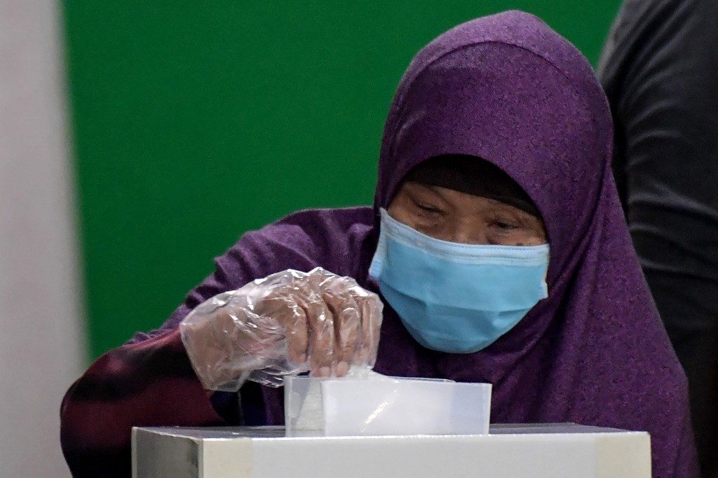 Singapore counts votes in pandemic poll