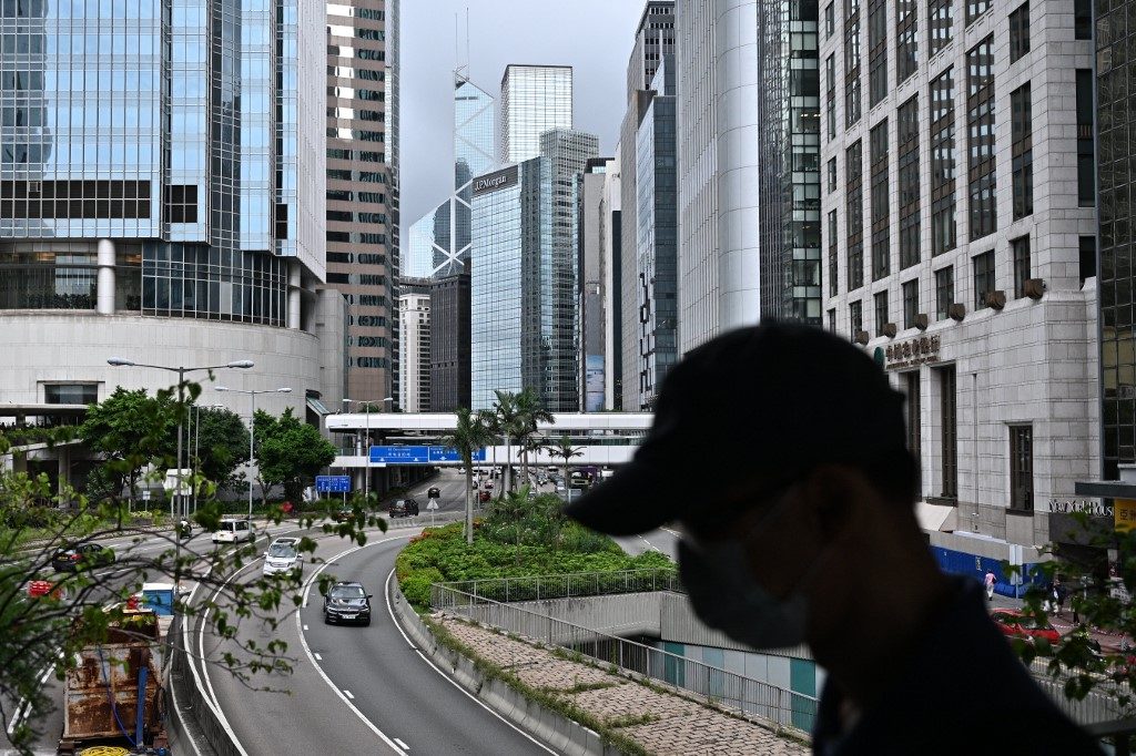 COVID-19 IN HONG KONG. A man wearing a face mask walks in the Central district of Hong Kong on July 9, 2020, as the city experiences new local outbreaks of the COVID-19 coronavirus. Photo by Anthony Wallace/AFP 