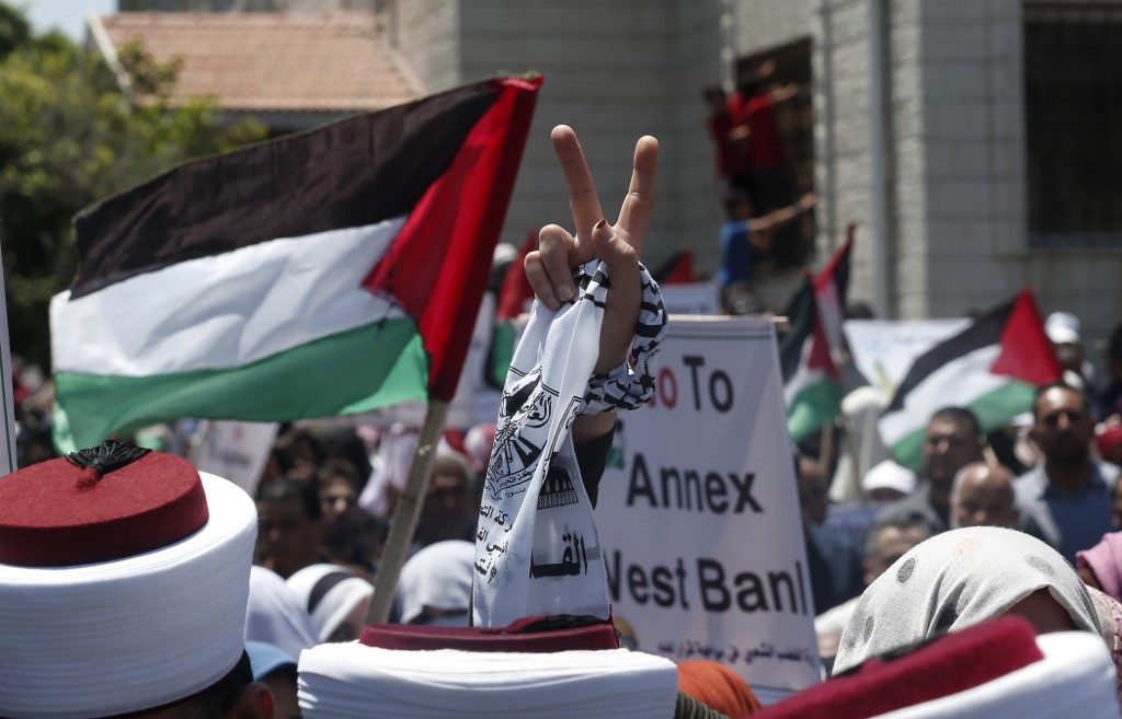 'DAY OF RAGE.' A Palestinian demonstrator flashes the victory sign during a rally as Palestinians call for a 'Day of Rage' to protest Israel's plan to annex parts of the occupied West Bank, in Gaza City on July 1, 2020. Photo by Mahmud Hams/AFP 