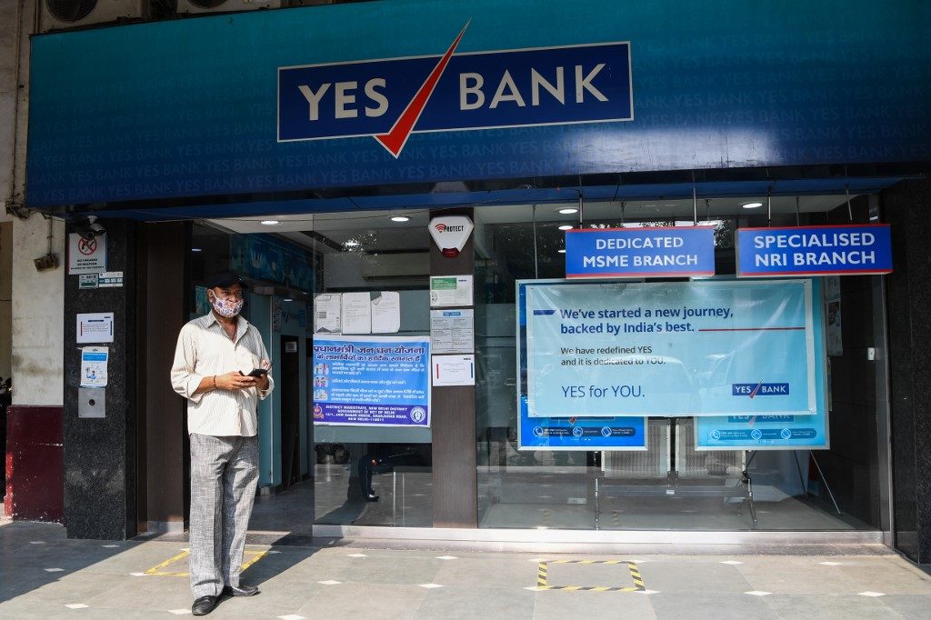 YES BANK. A man walks past a Yes Bank branch in New Delhi, India, on July 9, 2020. Photo by Prakash Singh/AFP 