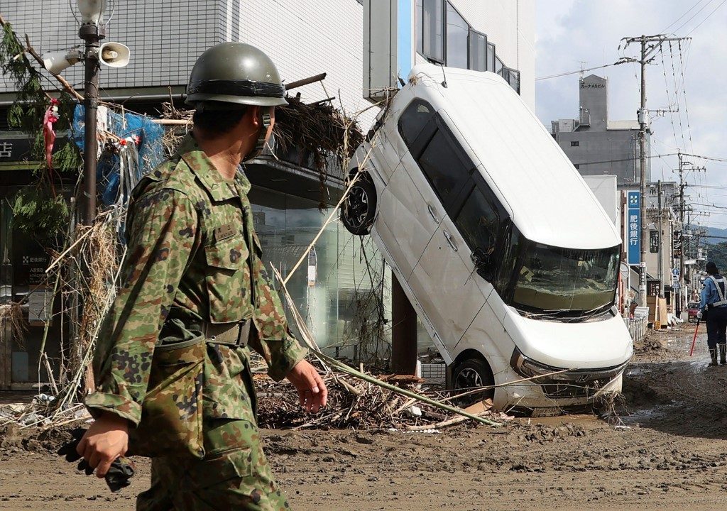 Japan issues fresh rain disaster warnings as toll hits 54
