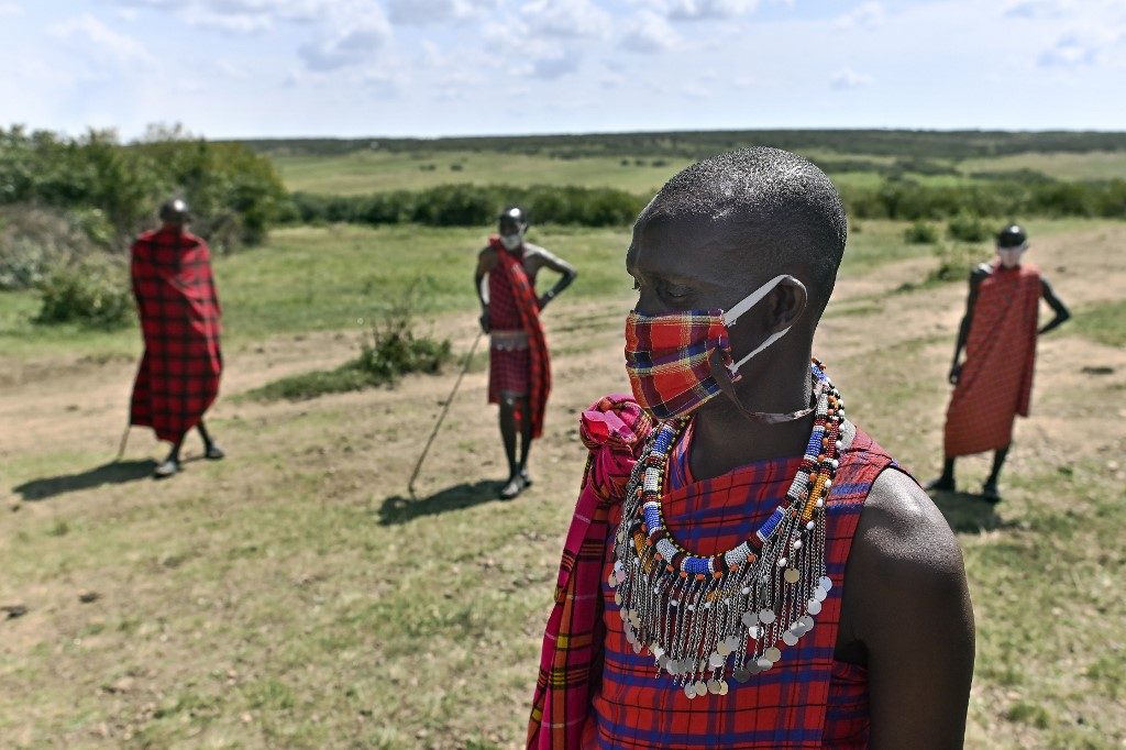 KENYA TOURISM. Cultural performers from the Maasai tribe gather outside their manyatta (village) in Talek in the Maasai Mara National Reserve, where their work of performing for visiting tourists has dwindled, on June 24, 2020. Photo by Tony Karumba/AFP 
