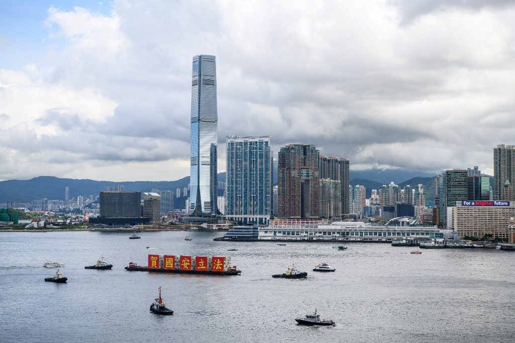 CONTROVERSIAL LAW. A barge with banners that read 'Celebrate the National Security Law' sails in Victoria Harbour on the 23rd anniversary of Hong Kong's handover from Britain, July 1, 2020. Photo by Anthony Wallace/AFP 