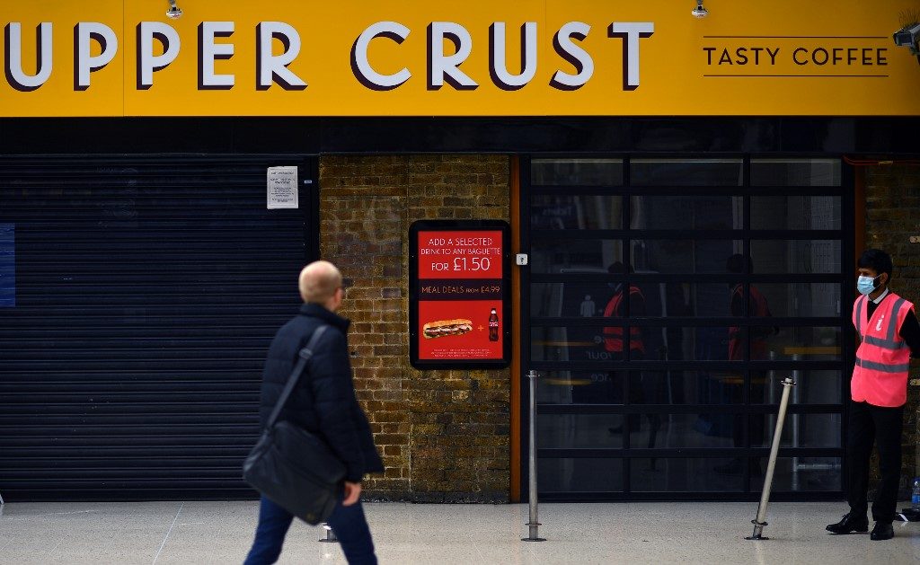 SHUTTERED. A pedestrian walks past a closed Upper Crust food outlet in Charing Cross train station in London on July 1, 2020. Photo by Ben Stansall/AFP 