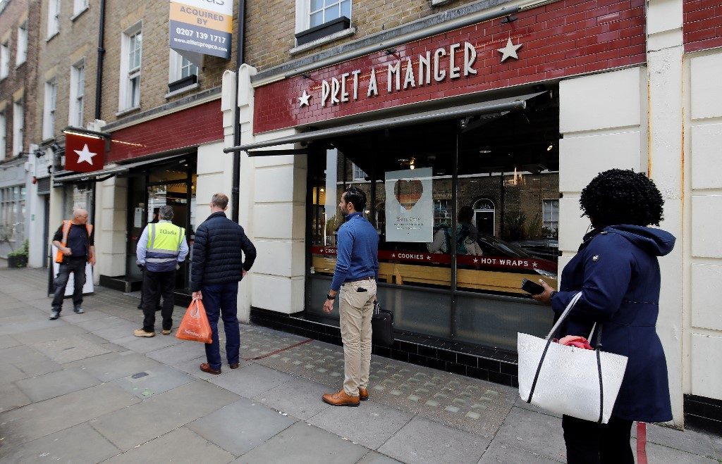 DISTANCING. Customers queue to enter a recently reopened Pret a Manger shop in London on May 4, 2020. Photo by Tolga Akmen/AFP 